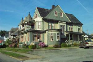 The Green Mansion in Scottdale, PA. I *love* the rounded room / corner of the house and wraparound porches.