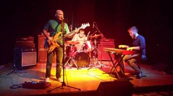 The Fire Tonight playing a show in 2014. Left to right: Collin Derrick, Stephen Russ, Jesse James